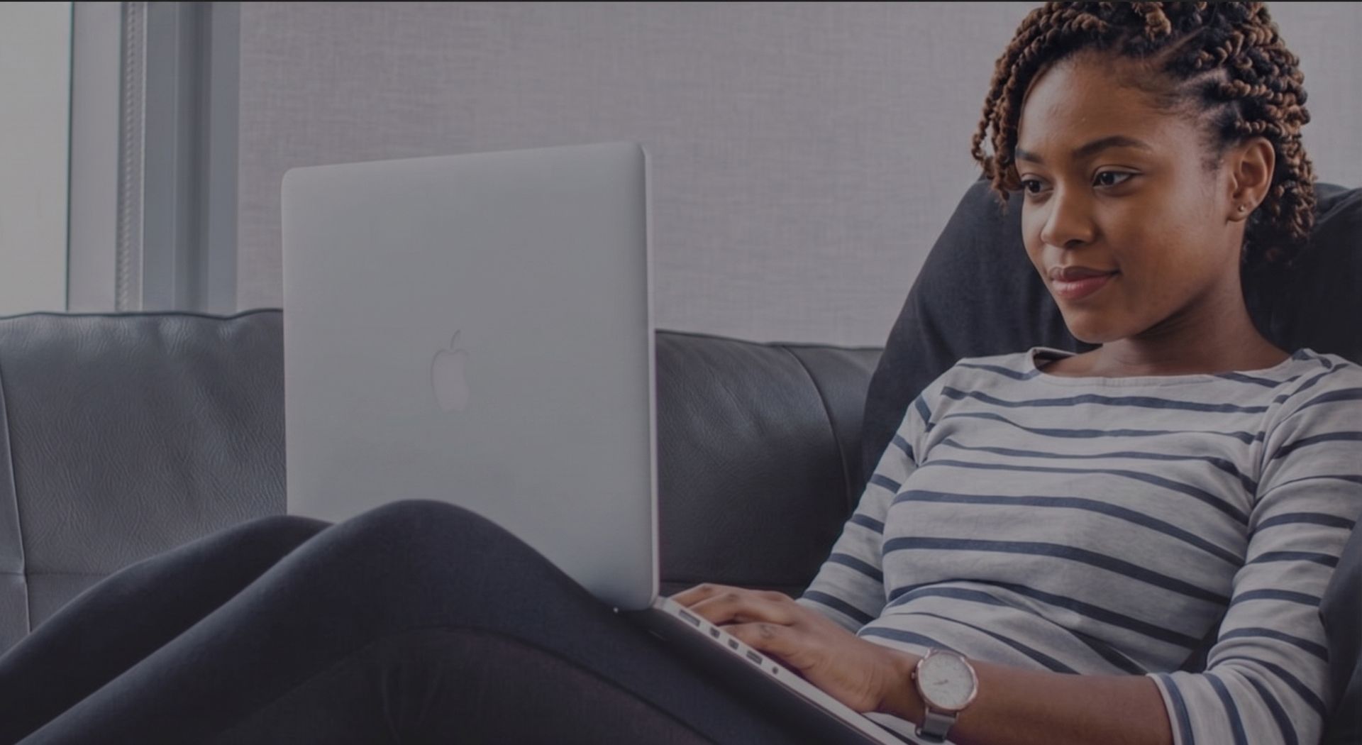 A student working at a laptop